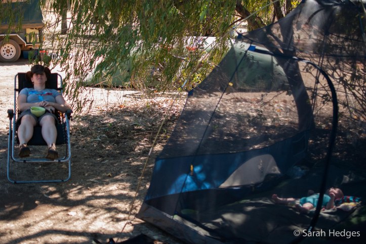 Rachel chills in my camp chair while Brynie chills in the tent.  The Hilleberg tent and bikes that you can just make out through the tree belong to an Australian/German couple who are cycling the Gibb River Road as the final stage in an 18-month long trip that started in Germany.  We enjoy chatting with them, and they give us lots of tips for good camping options along the way.