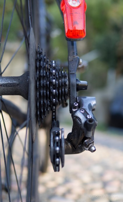 Fiddle with the limit screws to get into a reasonable gear.  Surprising how far in you can get.