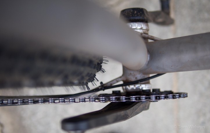 The crank/chainring are the same, but the drop-outs are swung to their inner most position.  Still enough chainstay clearance and the cable routing across the 'plate' works a treat.