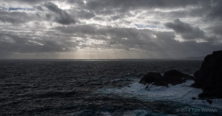 Rain was distinguished from the wave spray by taste.  Brooding skies and atmosphere weren't in short supply